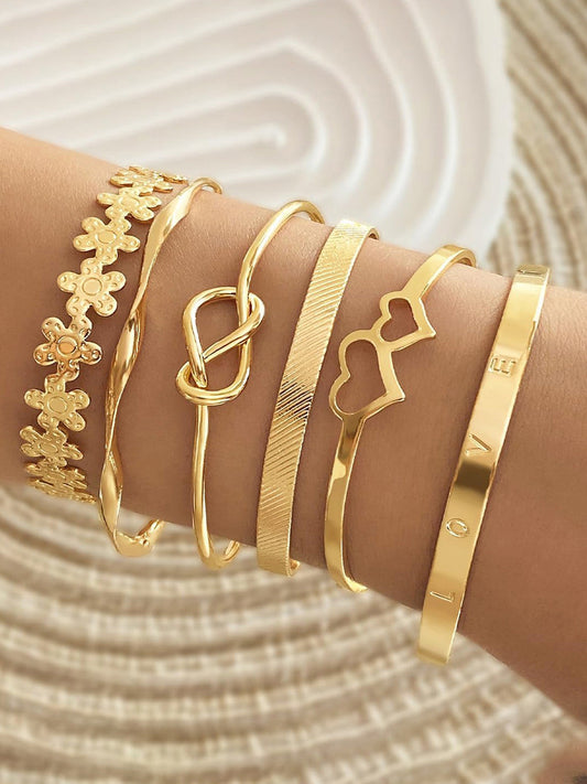 Stackable gold bangle set non‑tarnish cuff bracelets.