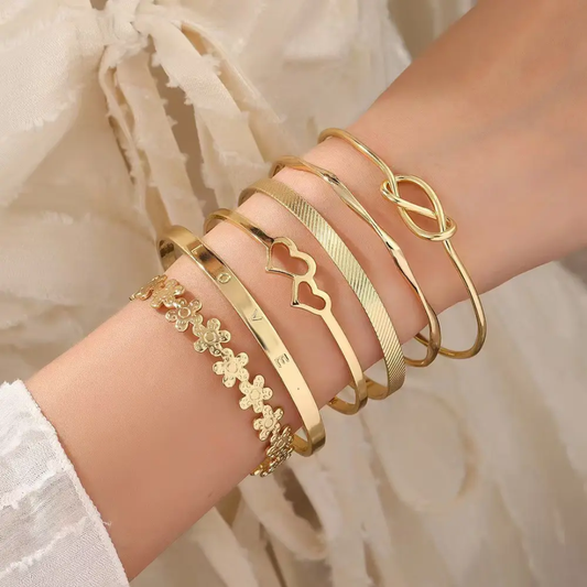 Stackable gold bangle set non‑tarnish cuff bracelets.