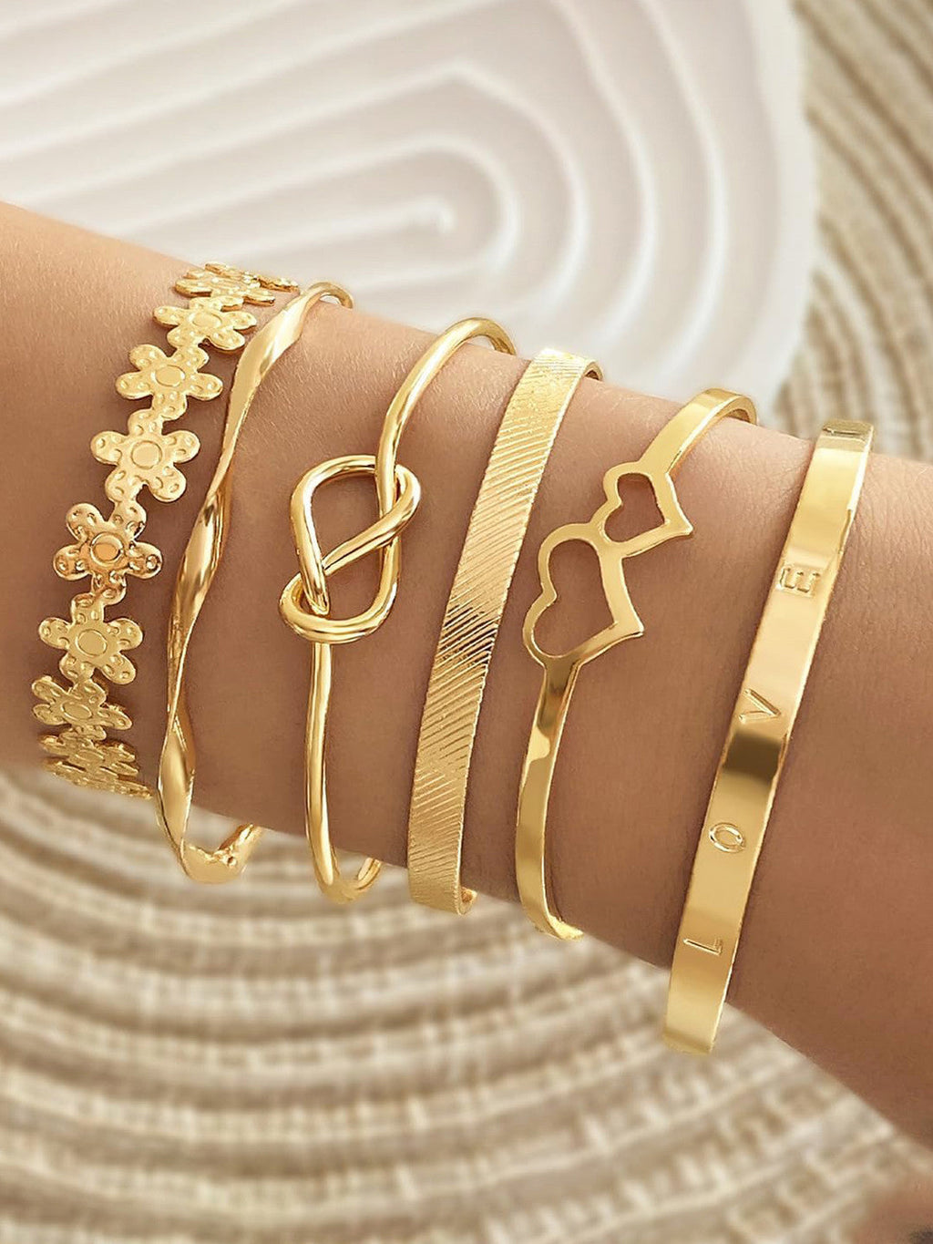 Stackable gold bangle set non‑tarnish cuff bracelets.